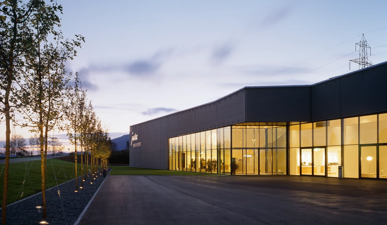 Building at sunset with illuminated glass facades