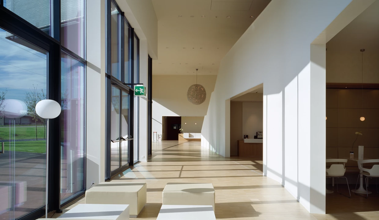 Bright interior with large windows and modern furniture