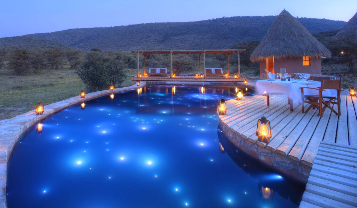 Atmospheric pool with lanterns at night.