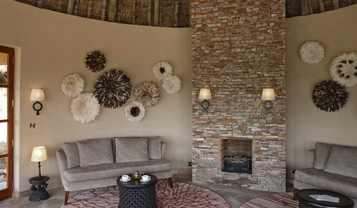 Living area with fireplace and wall decorations.