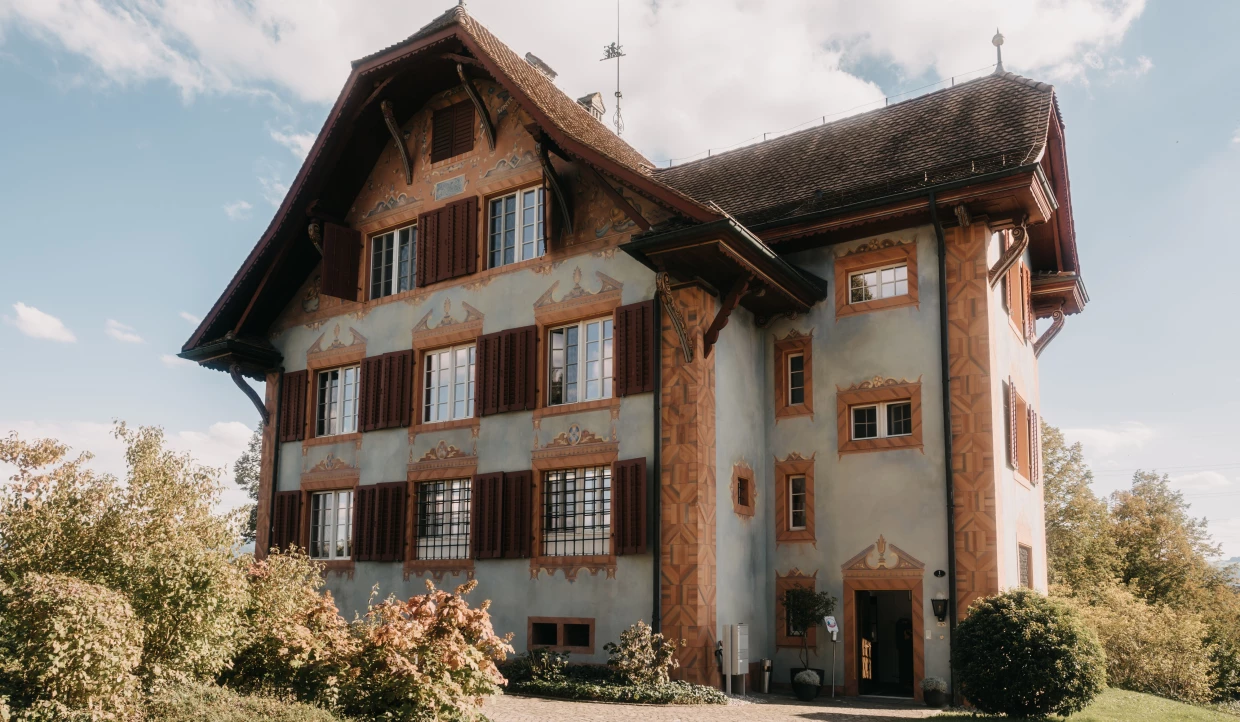 Historic building with wooden shutters and half-timber decoration