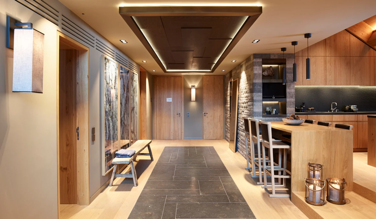 Modern kitchen with bar stools and wood decor